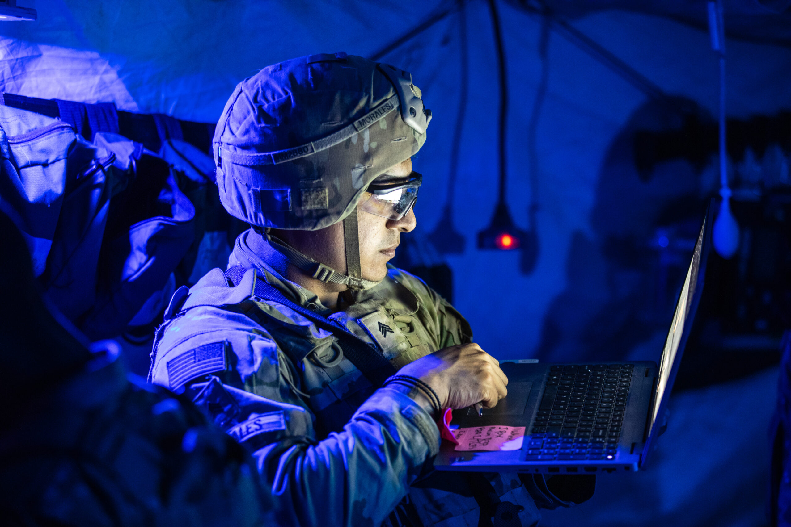 U.S. Army Sgt. Michael Morales, assigned to 41st Field Artillery Brigade, updates Soldier information in a battalion aid station during Saber Guardian 25, Cincu Training Area, Romania, June 13, 2025. The aid station enables rapid triage, treatment, and evacuation of casualties, ensuring readiness and lifesaving support in austere operational environments. (U.S. Army photo by Spc. Hunter Carpenter) Demonstrating global deterrence and the U.S. Army’s ability to rapidly deploy U.S.-based combat power in Europe and the Arctic region alongside Allies and partners, DEFENDER 25 brings U.S. troops together with forces from 29 Allied and partner nations to build readiness through large-scale combat training from May 11-June 24, 2025. DEFENDER 25 increases the lethality of the NATO alliance through large-scale tactical training maneuvers and long-range fires, builds unit readiness in a complex joint, multinational environment and leverages host nation capabilities to increase the U.S. Army’s operational reach. During three large-scale combat training exercises—Swift Response, Immediate Response, and Saber Guardian—Ally and partner forces integrate and expand multi-domain operations capability, demonstrating combined command and control structures and readiness to respond to crisis and conflict.