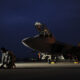 U.S. Air Force Airman 1st Class Aaron Tate enters data into his portable maintenance computer in front of an F-22A Raptor aircraft at Kadena Air Base, Japan, on Jan. 21, 2009. Tate and the jet are deployed from the 27th Fighter Squadron at Langley Air Force Base, Va. (DoD photo by Master Sgt. Andy Dunaway, U.S. Air Force. (Released))