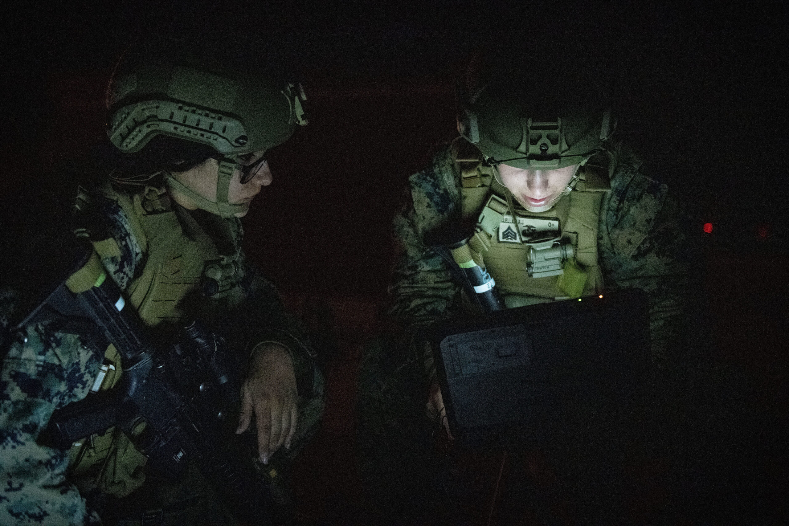 U.S. Marine Corps 22nd Marine Expeditionary Unit Marines utilize a computer while conducting a Composite Training Unit Exercise on the flight line at North Auxiliary Airfield, North, South Carolina, Jan. 25, 2022. The Marine units established an expeditionary advance base in support of a pre-deployment training capstone. (U.S. Air Force photo by Senior Airman Bailee A. Darbasie)