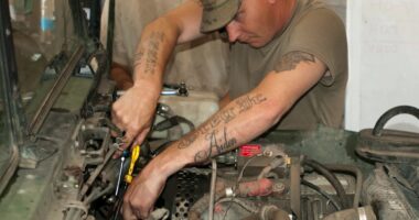 Spc. Gregory Wilson, a mechanic with Fox Company, 700th Brigade Support Battalion, 45th Infantry Brigade Combat Team, works to repair the fuel system on a Humvee while deployed in support of the Joint Multinational Training Group-Ukraine at the Yavoriv Combat Training Center on the International Peacekeeping and Security Center in Western Ukraine on Aug. 9, 2017
