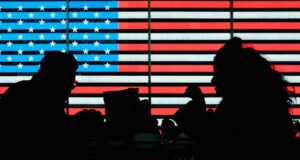 Two US military personnel operating technology