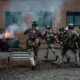 US Special Operations Forces soldiers conduct a breaching operation during a training exercise in an urban environment.