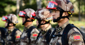 Soldiers from the People’s Liberation Army (PLA) listen to a briefing in preparation for a search and extraction exchange during the 13th annual U.S.-China Disaster Management Exchange at Camp Rilea Armed Forces Training Center, November 17, 2017, in Warrenton, Ore. U.S. Army Pacific hosts the annual exchange with the PLA to foster mutual trust and understanding while sharing lessons learned to increase disaster response capabilities in the Pacific region. (Photo by Sgt. 1st Class April Davis, Oregon Military Department Public Affairs)
