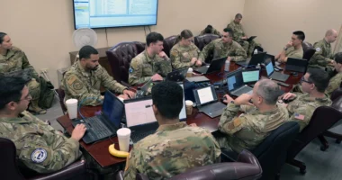 Anthropic vs Pentagon | US servicemembers in uniform use laptops during a cybersecurity assessment in a government facility.