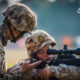 A sniper assigned to a brigade under the Chinese PLA Western Theater Command practice aiming and positioning with a CS/LR4 sniper rifle during a sniper training session.
