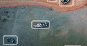 AI-driven object detection highlights vessels in sensor data, illustrating how Striveworks’ Chariot Core enables real-time threat detection and multi-domain awareness.