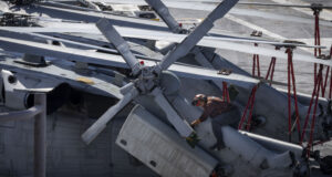 250812-N-NQ605-1055 ATLANTIC OCEAN (Aug. 12, 2025) Aviation Electronics Technician Airman Zurial Jones, assigned to the “Nightdippers” of Helicopter Sea Combat Squadron (HSC) 5, performs maintenance on an MH-60S Sea Hawk helicopter aboard the Nimitz-class aircraft carrier USS George H.W. Bush (CVN 77). George H.W. Bush is underway conducting carrier qualifications and routine operations in the Atlantic Ocean. (U.S. Navy photo by Mass Communication Specialist 2nd Class Ceszar Villalbabaldonado)