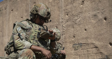Staff Sgt. Victor Corena, assigned to Assault Company, 1st Battalion, 8th Infantry Regiment, 3rd Armored Brigade Combat Team, 4th Infantry Division, checks operational data on his end-user device during a field training exercise that demonstrates Next Generation Command and Control AN/PRC-166 radio technology on Fort Carson, Colorado, on September 18, 2025. The NGC2 ecosystem integrates software applications, infrastructure, data, and transport into a unified operational architecture, providing commanders with real-time information to make more, better and faster decisions. (U.S. Army photo by Sgt. William Rogers)