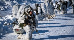 Troops in formation at an icy environment. Photo: Canadian Armed Forces