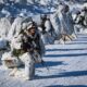 Troops in formation at an icy environment. Photo: Canadian Armed Forces