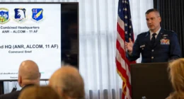 A US Air Force officer delivers a headquarters briefing during an Eleventh Air Force event.