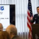 A US Air Force officer delivers a headquarters briefing during an Eleventh Air Force event.