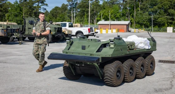 A US Marine Corps service member operates expeditionary logistics equipment during field testing. The Marine Corps is expanding AI-enabled sustainment and battlefield networking capabilities through Project Dynamis.