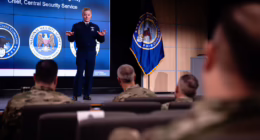 Gen. Timothy Haugh speaks before military personnel during a US CyberCom cyber intelligence summit at Fort Meade.