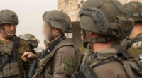Israeli soldiers coordinate during a field operation.