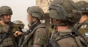 Israeli soldiers coordinate during a field operation.