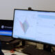 GE Aerospace researcher reviewing data from a generative AI application used to design and assess hypersonic ramjet engine concepts on a computer workstation.