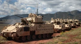 US Army armored vehicles from the 4th Infantry Division maneuver during a Next Generation Command and Control technology demonstration at Fort Carson, Colorado.