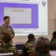 U.S. Army cyber specialist briefs Tanzania People’s Defence Force personnel during a cyber defense training session, with network security and cyber operations materials displayed on a projection screen in Dar es Salaam, Tanzania.