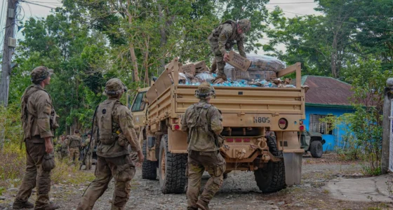 U.S. Army soldiers unload supply boxes from a military truck during a logistics resupply operation in the Philippines, supporting sustainment and distribution missions.