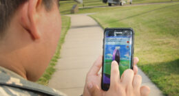 Airman 1st Class Orlando Saenz, services specialist, 184th Force Support Squadron, finds a Pokéstop in the airpark at McConnell Air Force Base July 27. The purpose of Pokémon Go is to get gamers off the couch and out in the community through an interactive game.