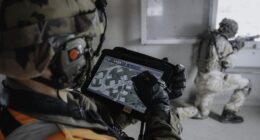A soldier uses Thales' GLADIATOR Live Training system during a military exercise, providing real-time data collection and analysis to support performance assessment and After Action Reviews. Image: Thales