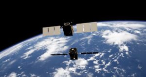 Satellites in orbit above Earth. AFRL and PiLogic are exploring explainable AI to improve satellite health monitoring and autonomy.
