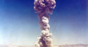 Military personnel observe the Buster-Jangle "Dog" nuclear test conducted at the Nevada Test Site in 1951. CIA Director John Ratcliffe recently compared the capabilities of frontier AI models to "digital nuclear weapons."