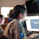 Military members man computer workstations
