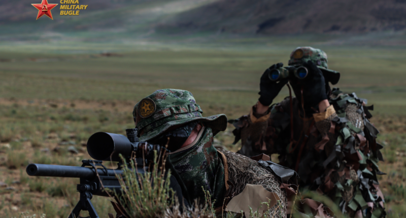 A sniper team assigned to a unit under the Chinese PLA Xizang Military Command conducts observation during a multi-subject reconnaissance training exercise.