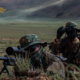 A sniper team assigned to a unit under the Chinese PLA Xizang Military Command conducts observation during a multi-subject reconnaissance training exercise.