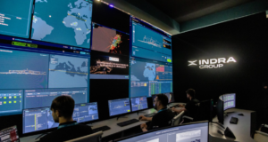 Indra personnel monitor operational data across multiple displays at an Indra command and control facility. Image: Indra Group