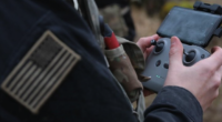 A personnel operates a drone controller during an exercise involving Safe Pro Group's AI-powered threat detection technology. Photo: Safe Pro Group