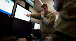 US Air Force intelligence personnel work with multiple data sources at Joint Base Langley-Eustis, Virginia.