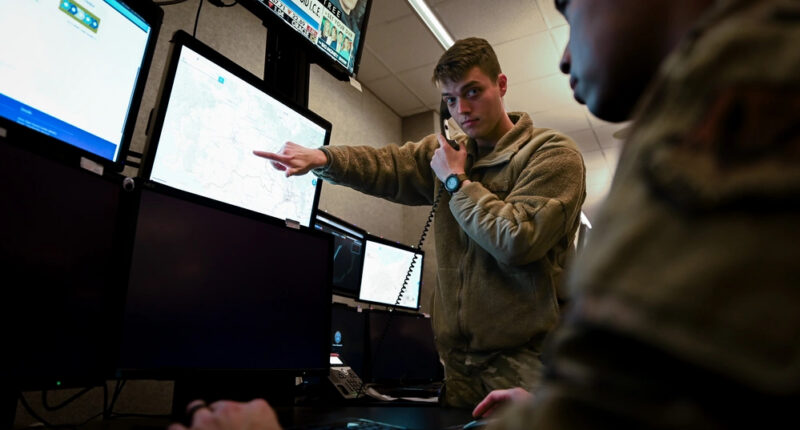 US Air Force intelligence personnel work with multiple data sources at Joint Base Langley-Eustis, Virginia.