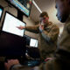 US Air Force intelligence personnel work with multiple data sources at Joint Base Langley-Eustis, Virginia.
